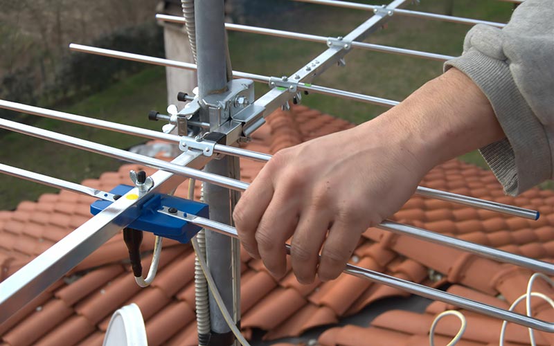 technician installing digital TV antenna